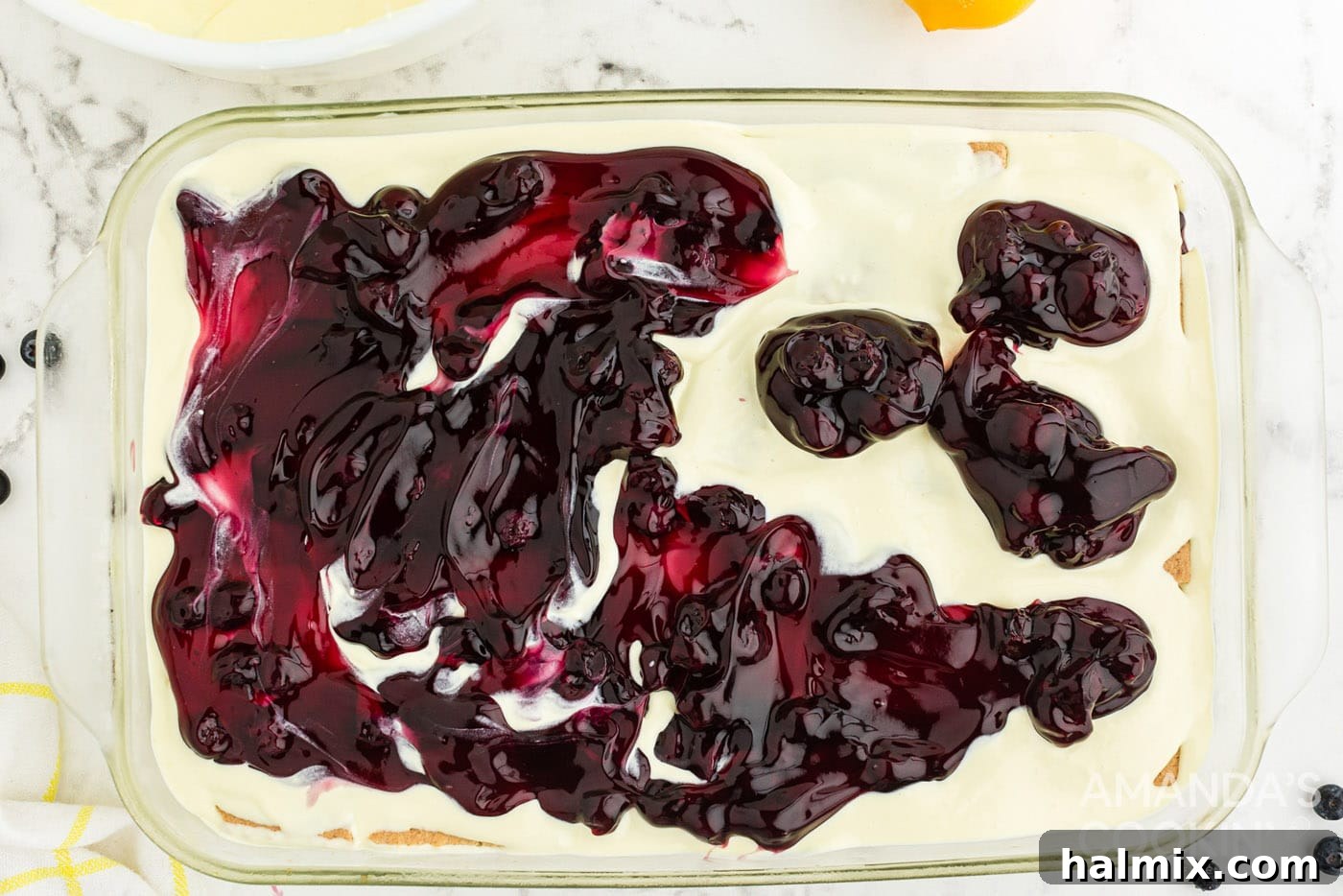 Zesty Lemon Blueberry No-Bake Delight 11 blueberry pie filling on top of pudding in a casserole dish