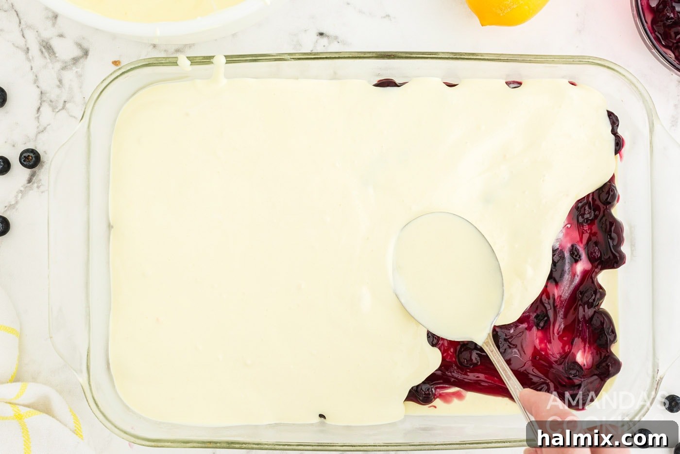 Zesty Lemon Blueberry No-Bake Delight 9 layering pudding on top of blueberry pie filling