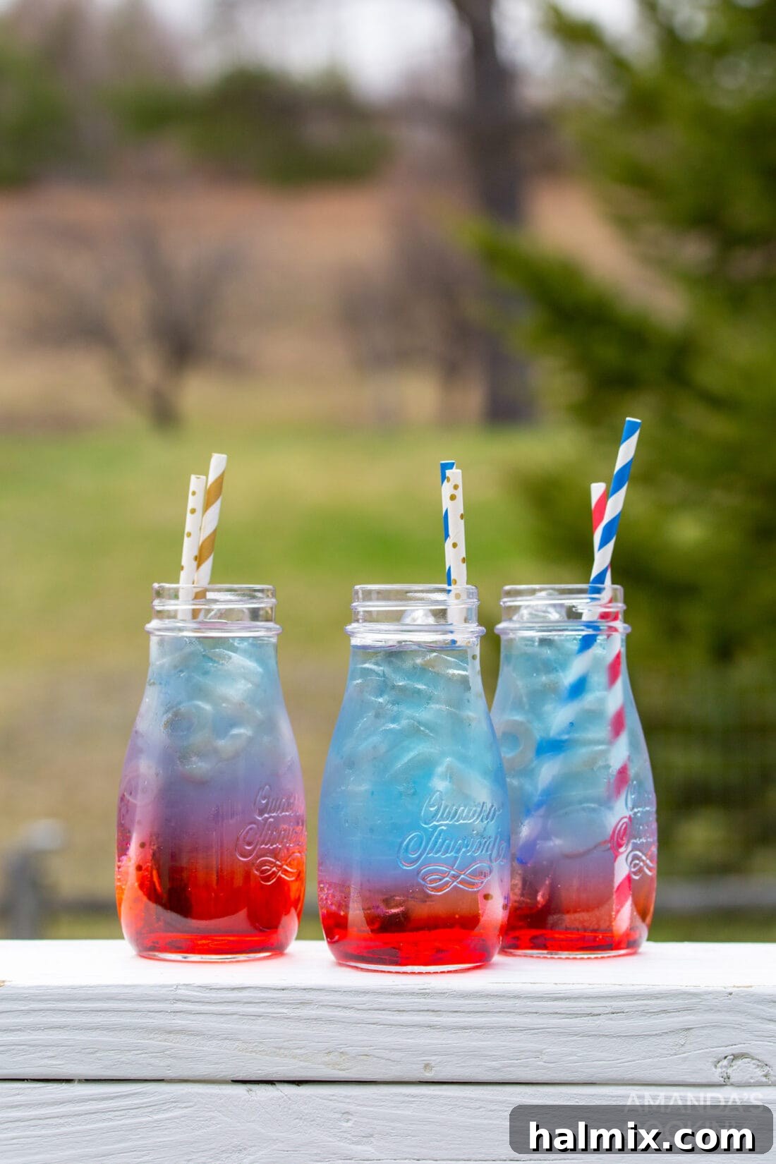 Individual jars of perfectly layered red, white, and blue patriotic punch
