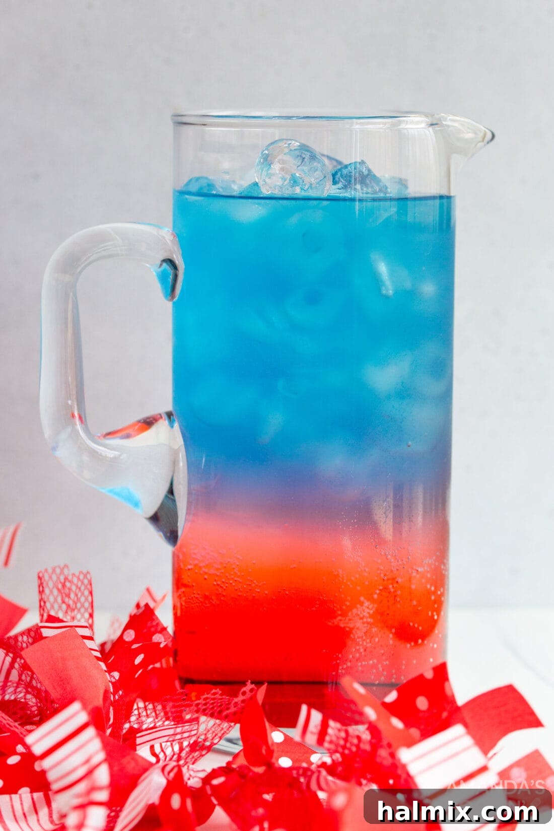 Large pitcher of patriotic punch, with layers starting to blend