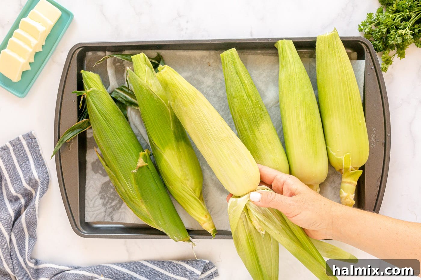 removing tough outer husks from corn