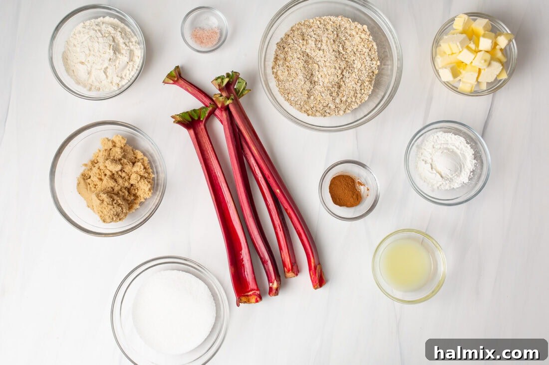 Sweet & Tangy Rhubarb Crunch 4 A selection of fresh rhubarb stalks, oats, flour, sugar, and butter laid out on a table, ready for baking