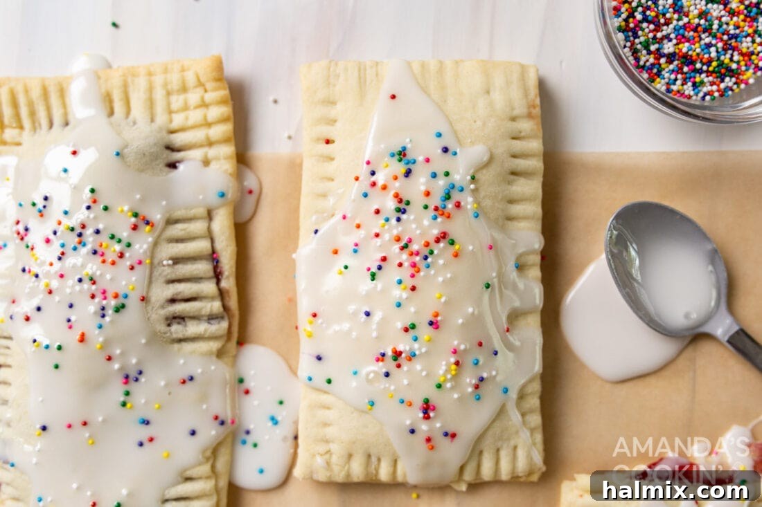 An assortment of homemade pop tarts, some with sprinkles, others with plain glaze