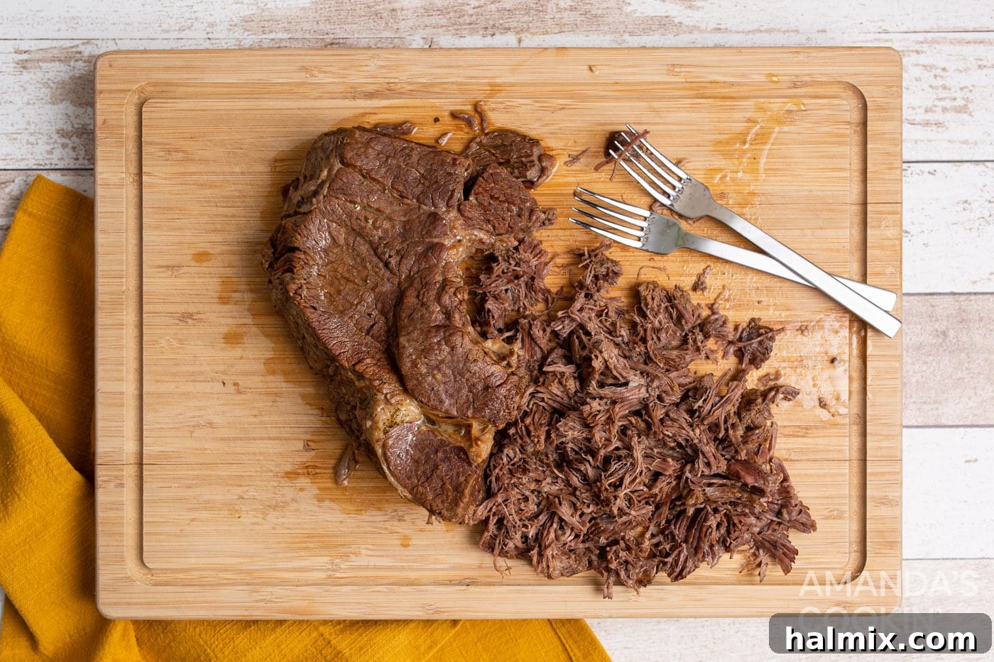 Mississippi Magic in Your Instant Pot 7 shredded chuck roast on cutting board