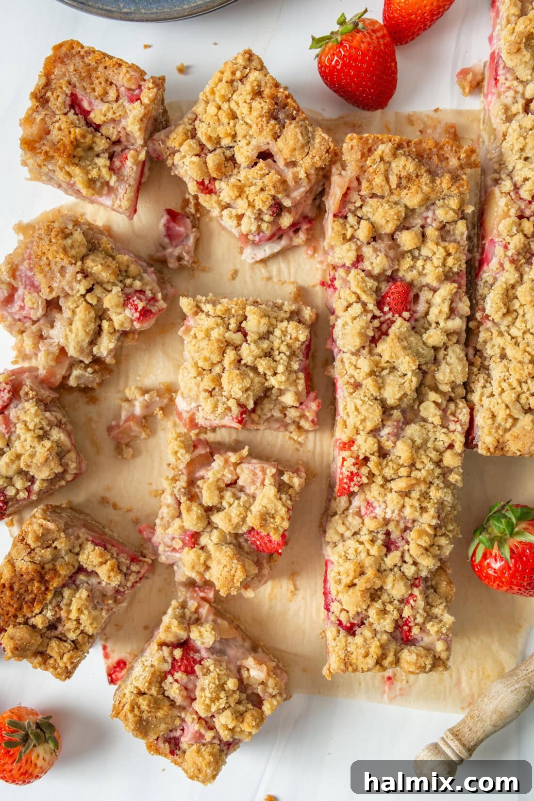 Strawberry Rhubarb Crumble Bars cut into perfect squares, showcasing the vibrant fruit filling and golden oat crumble topping