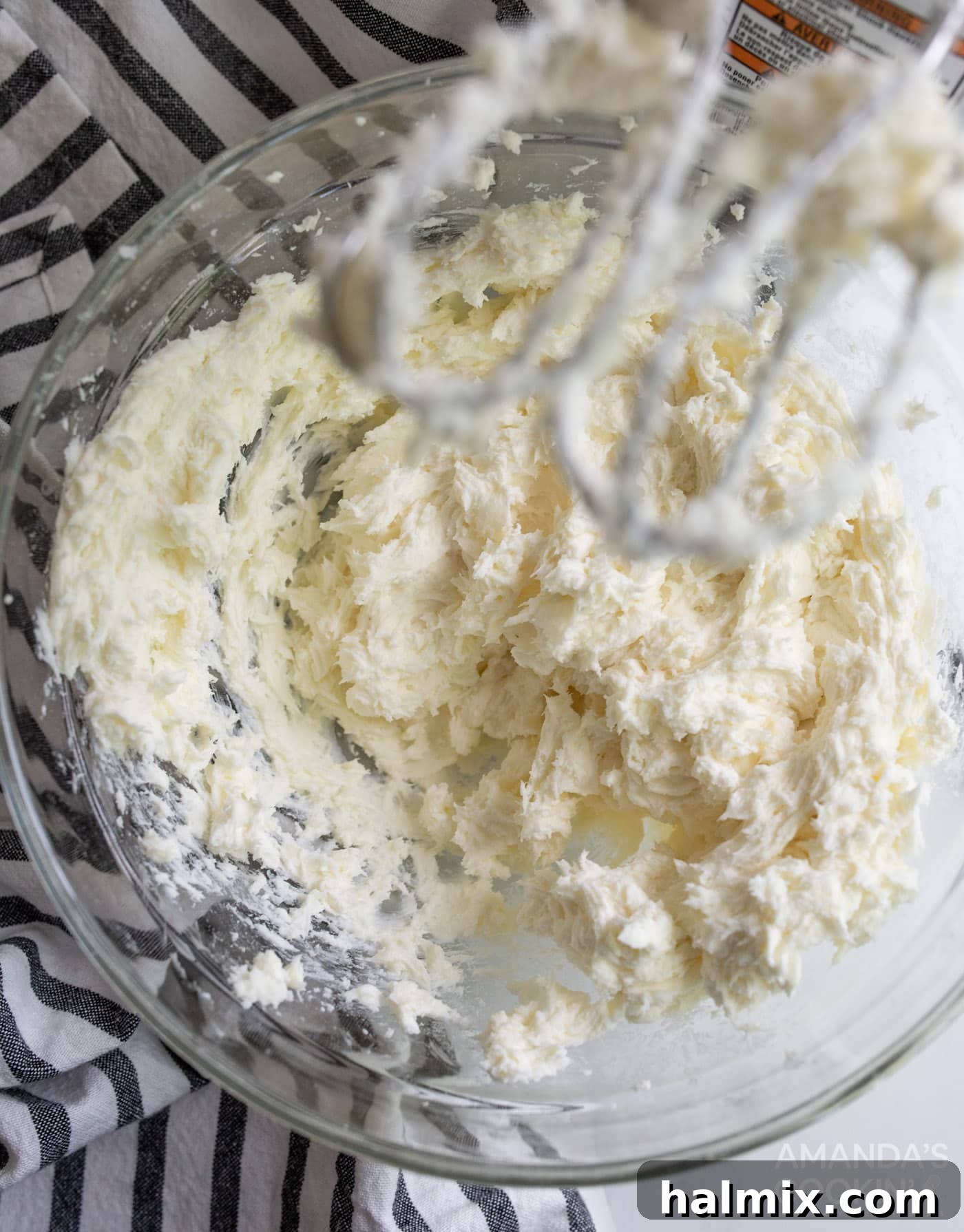 cream cheese, sugar, and flour mixed in bowl