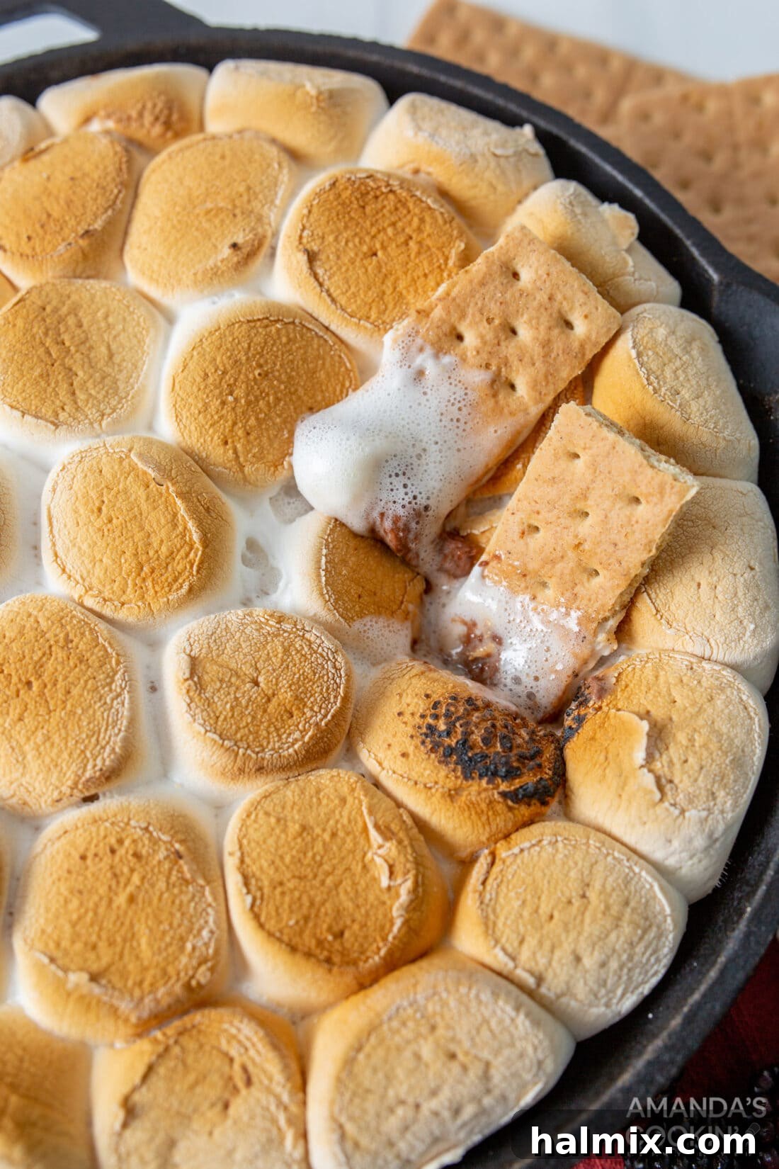 Gooey S'mores Skillet 2 S'mores Dip with golden toasted marshmallows and melted chocolate, served with graham crackers for dipping