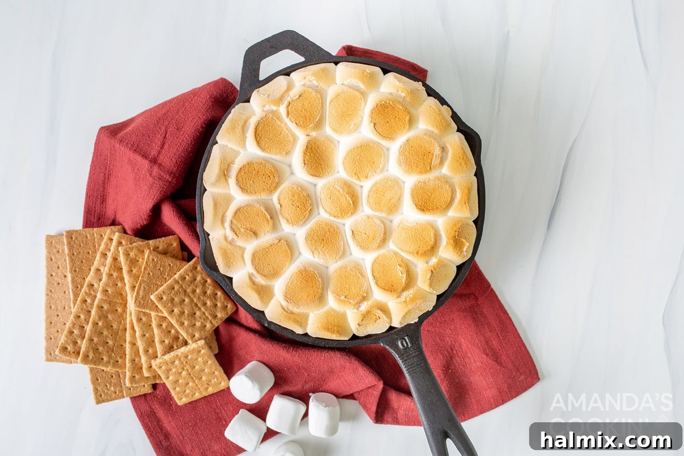 Gooey S'mores Skillet 7 overhead shot of finished s'mores dip with perfectly toasted golden marshmallows in a cast iron skillet