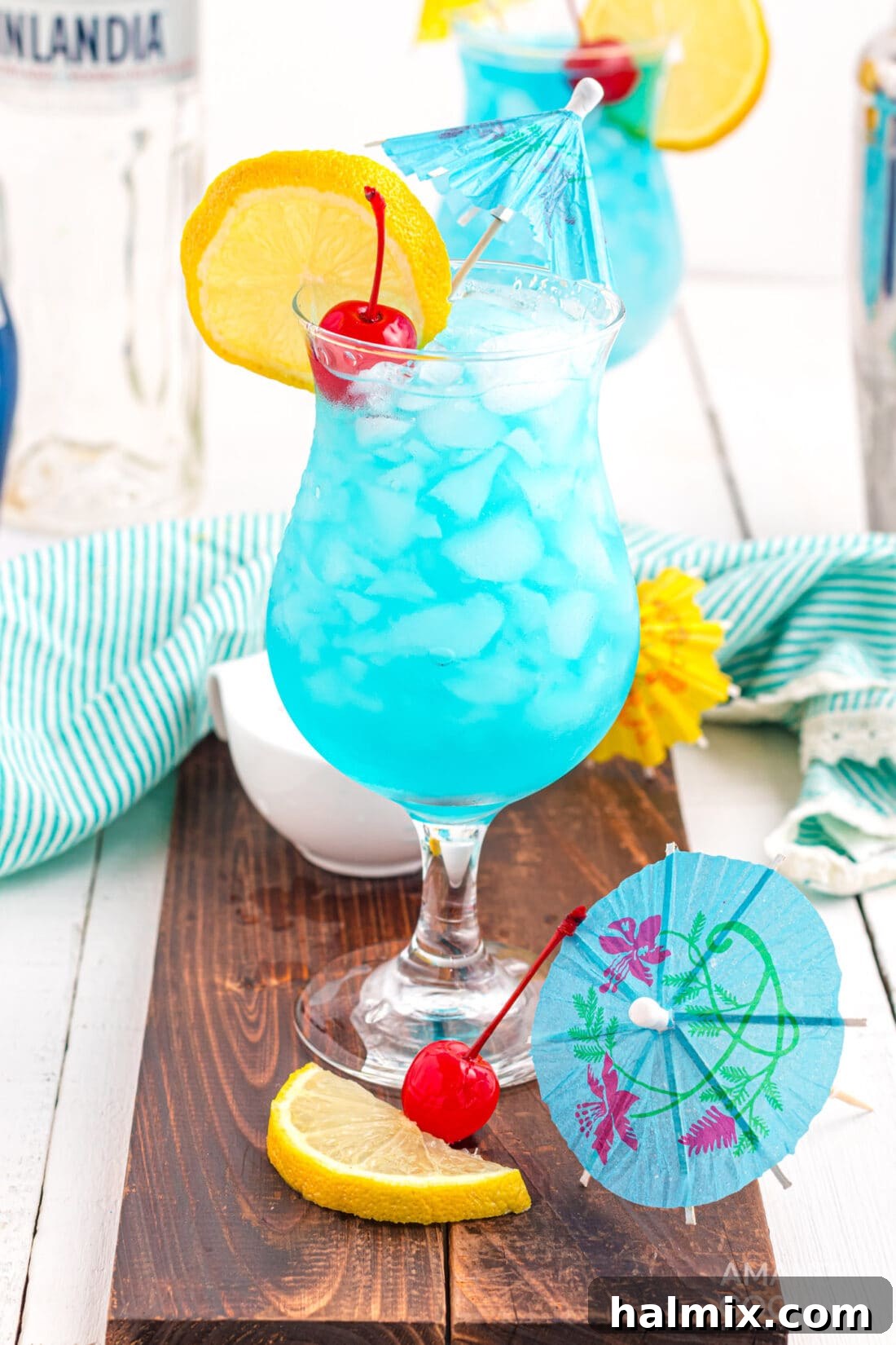 Azure Escape 2 Blue Lagoon Cocktail: A citrusy, three-ingredient summer drink perfect for poolside relaxation or patio gatherings. This vibrant blue cocktail evokes tropical getaway vibes.