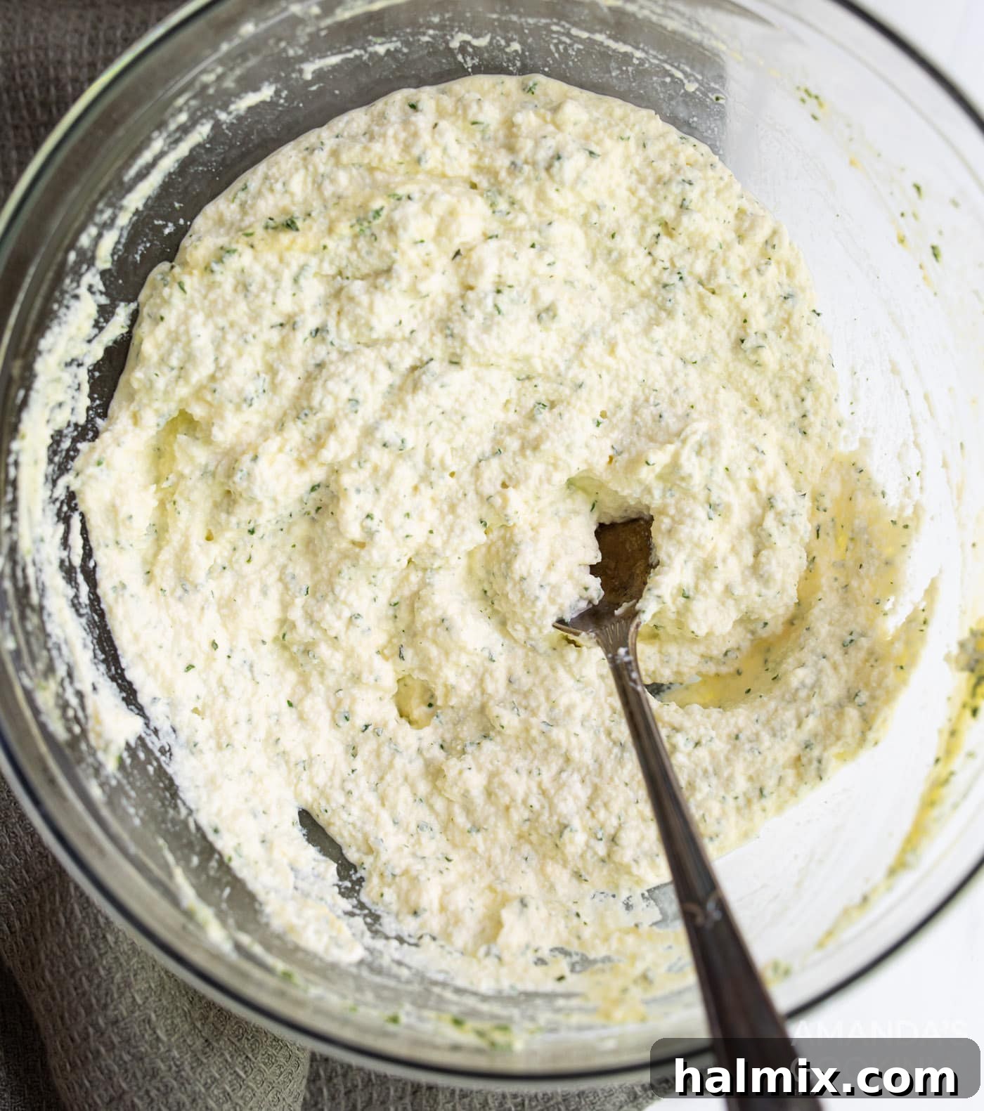 Effortless Instant Pot Lasagna 7 Ricotta cheese, a beaten egg, and fresh parsley are blended together in a medium bowl, creating a creamy and aromatic mixture for the lasagna.