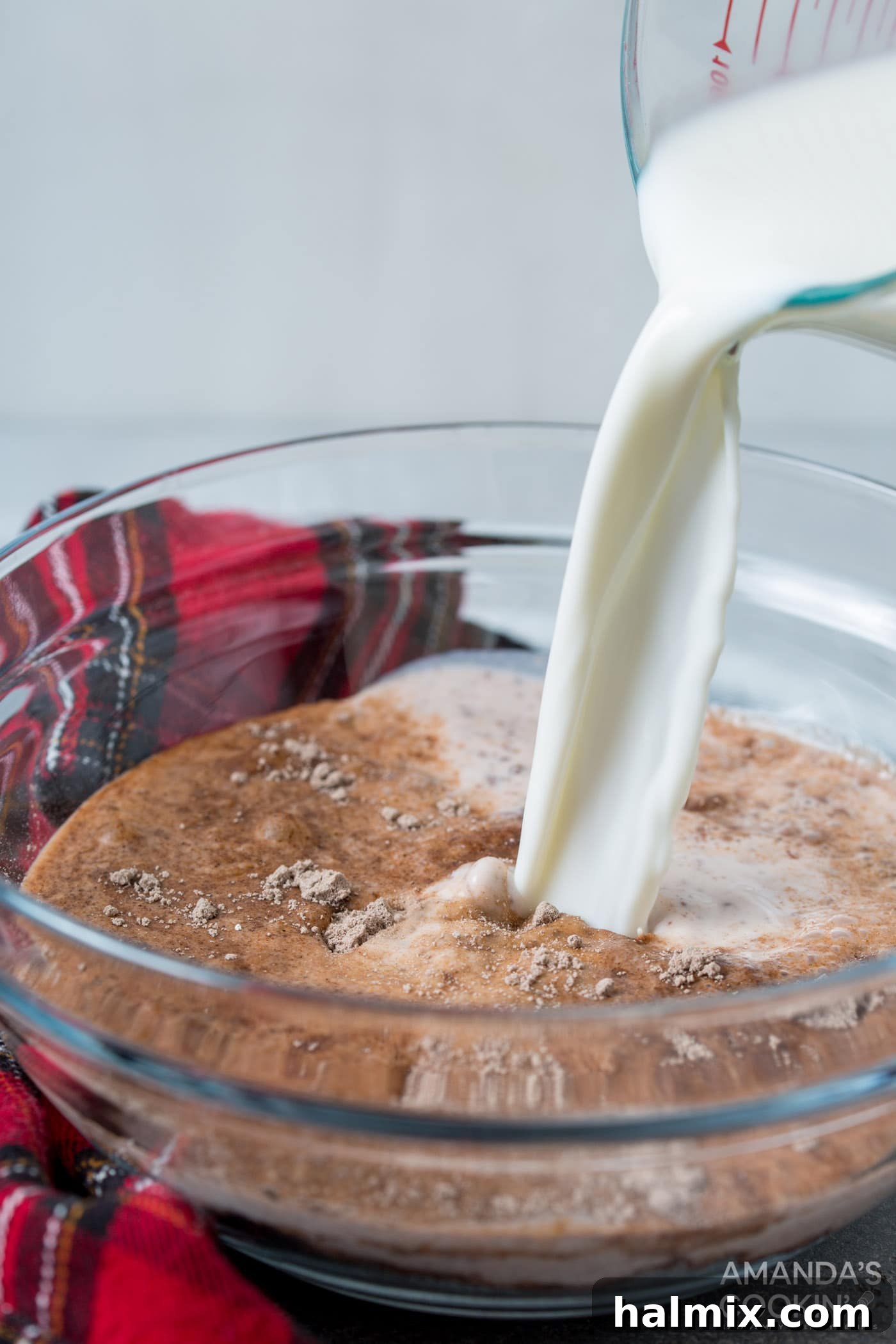 Frosty S'mores 5 pouring milk into chocolate pudding mix