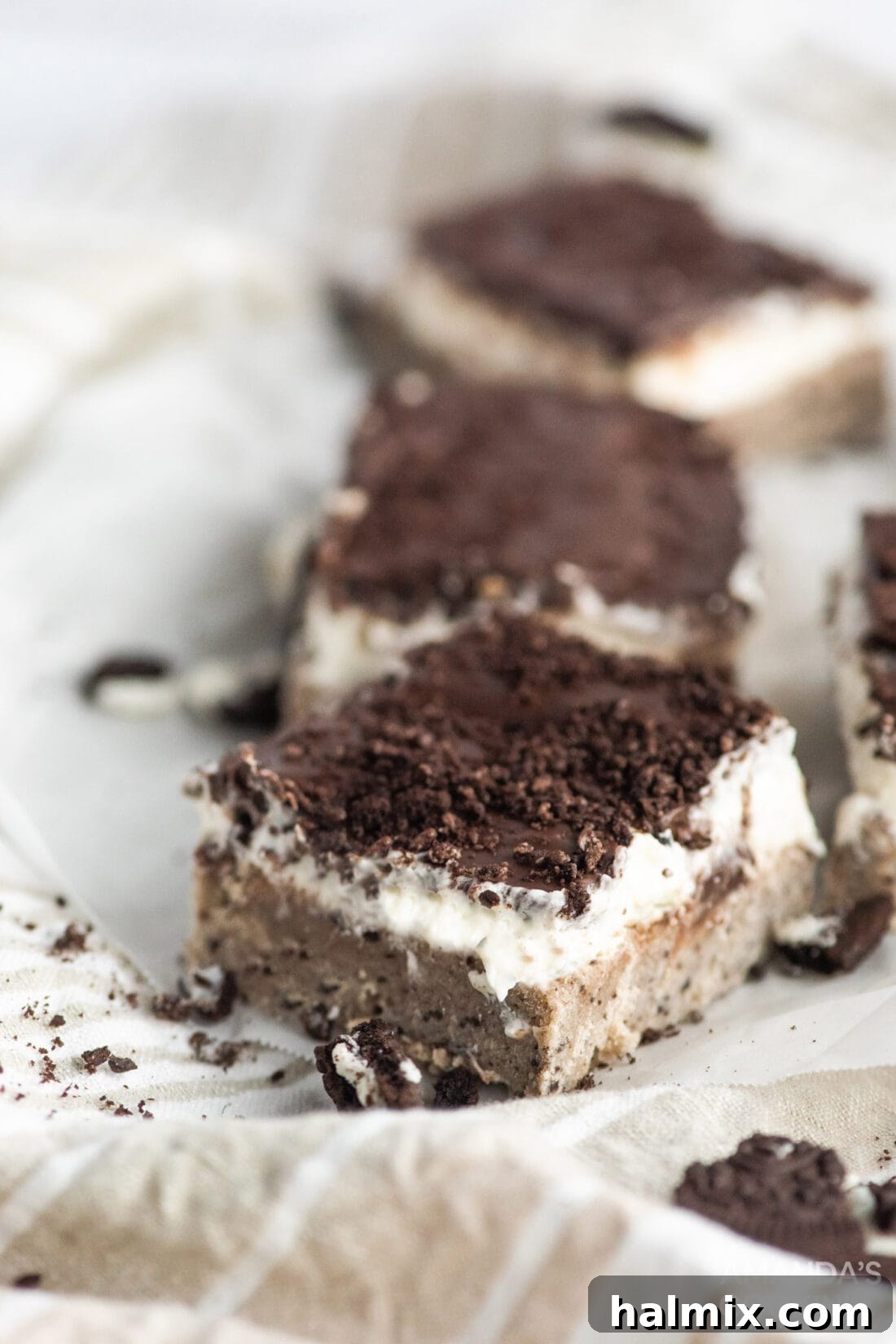 Stacked Oreo cheesecake bars with rich layers