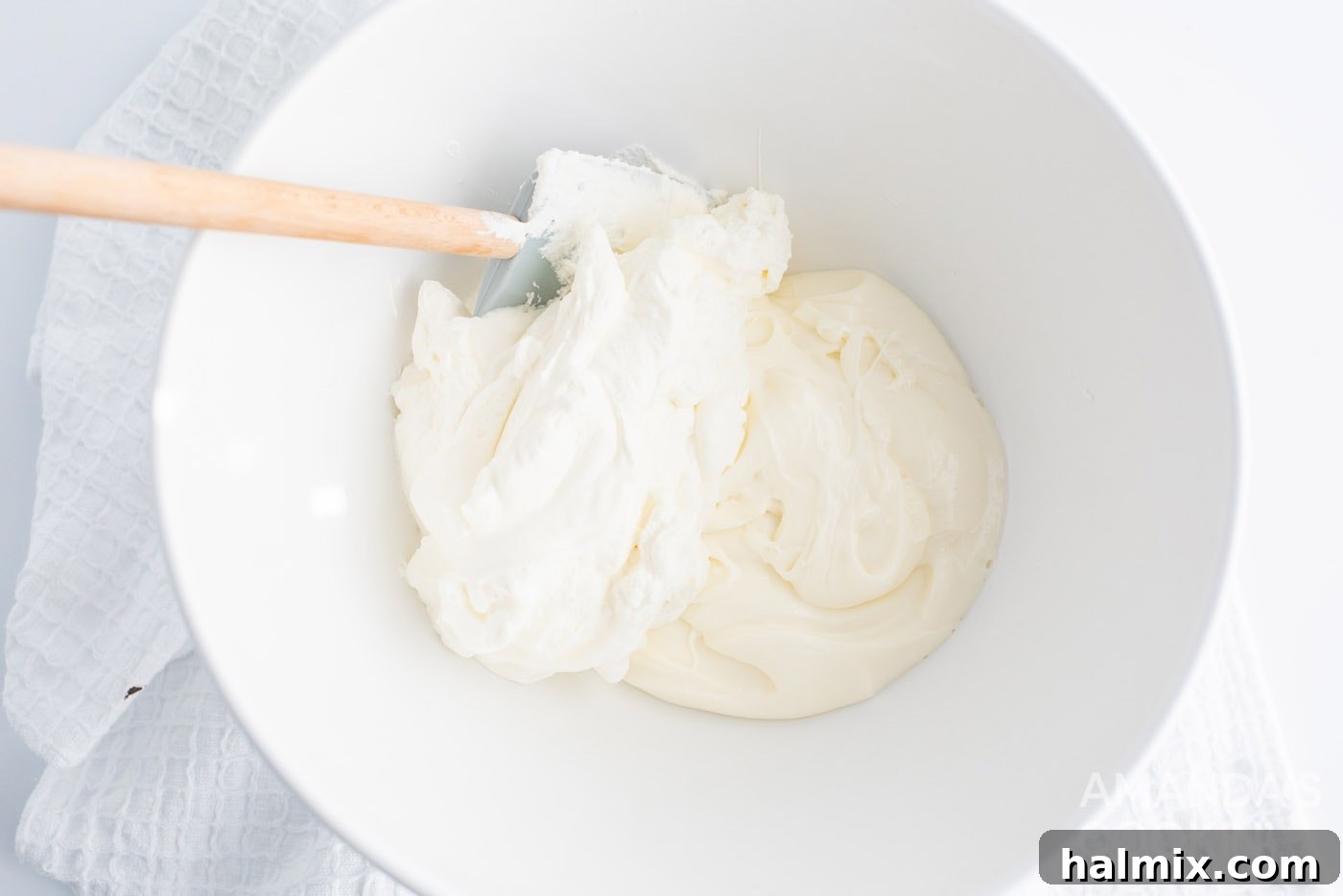 Smooth cheesecake and whipped topping mixture in a bowl