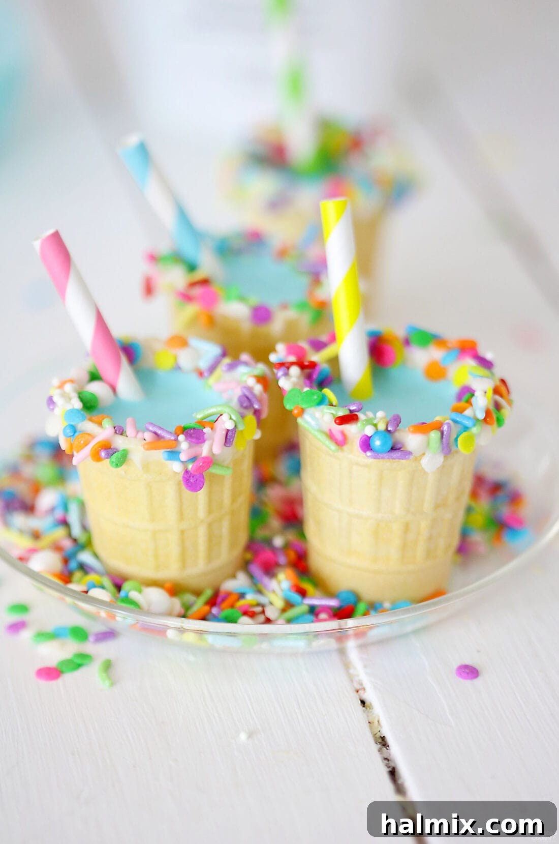 Colorful Rum Chata Shots in Edible Ice Cream Cones with Sprinkles
