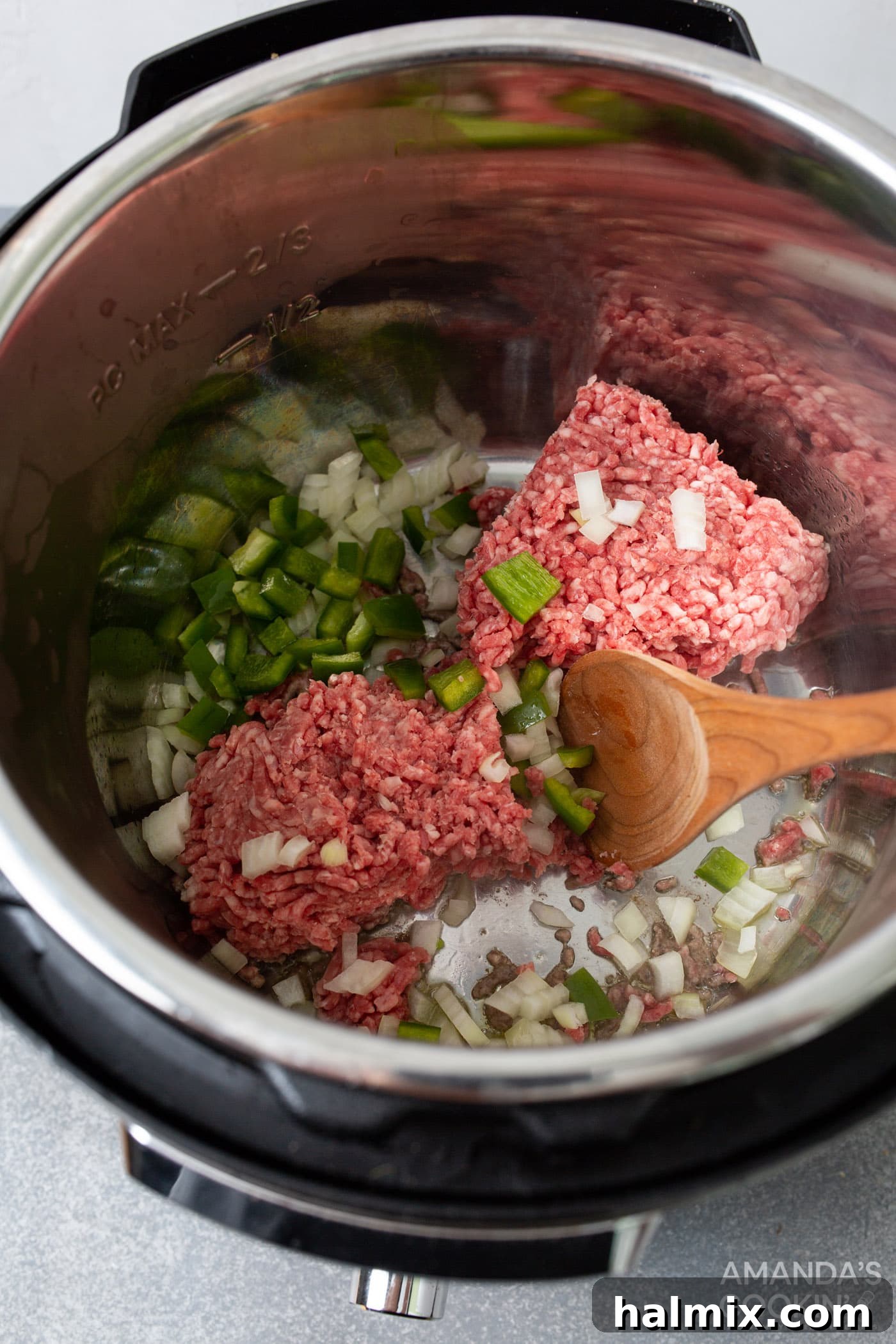 browning ground beef, green pepper, and onion in the instant pot