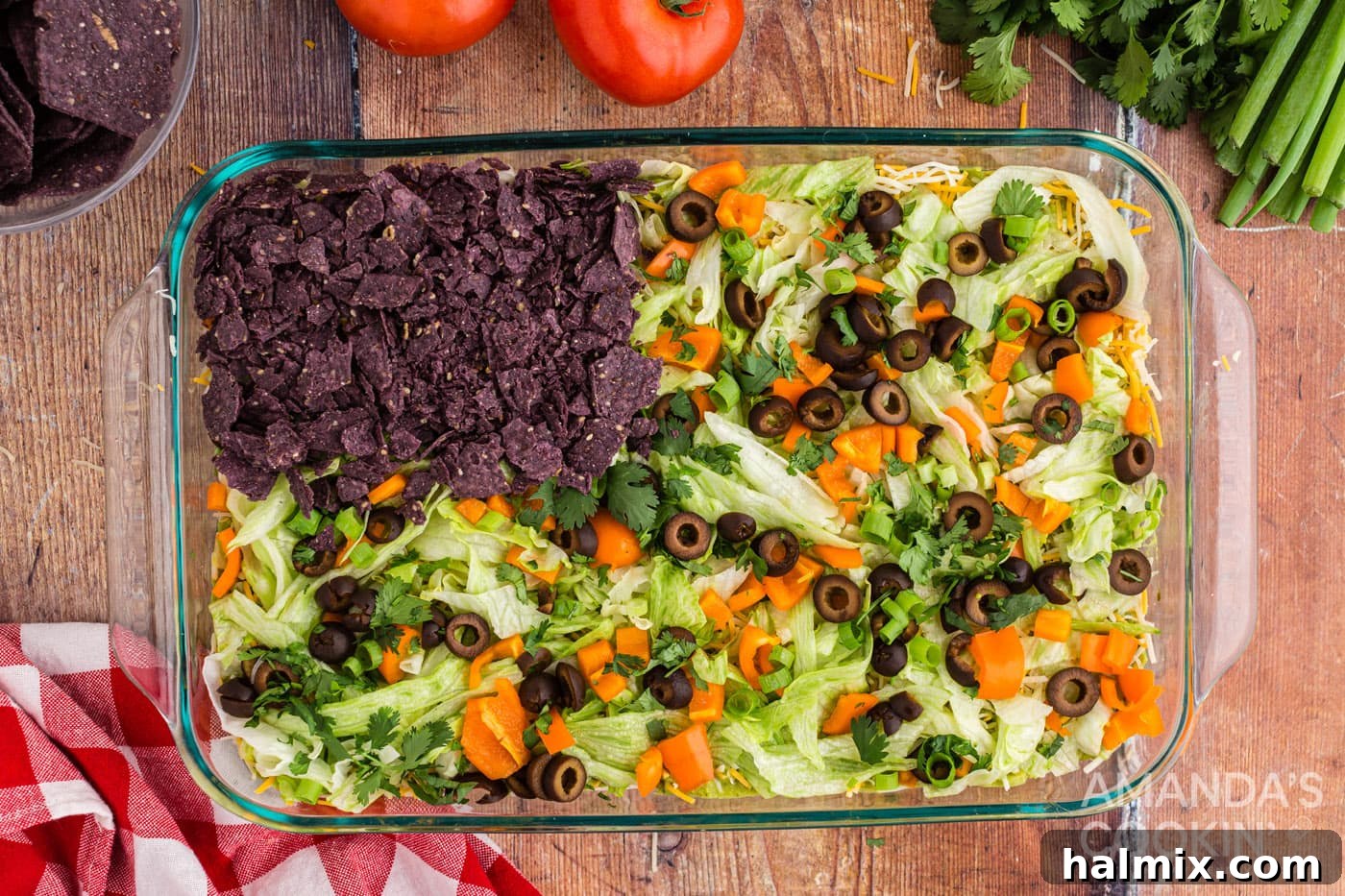 Crushed blue tortilla chips forming the blue section of the flag on the taco dip.