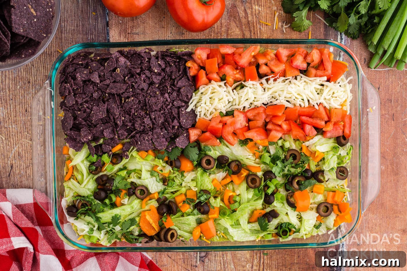 Stripes of chopped tomatoes and mozzarella cheese forming the flag design on the taco dip.