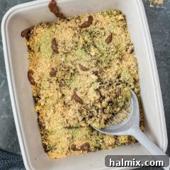 A Kitty Litter Cake with a scoop ready to serve, a perfect gross-out Halloween dessert.