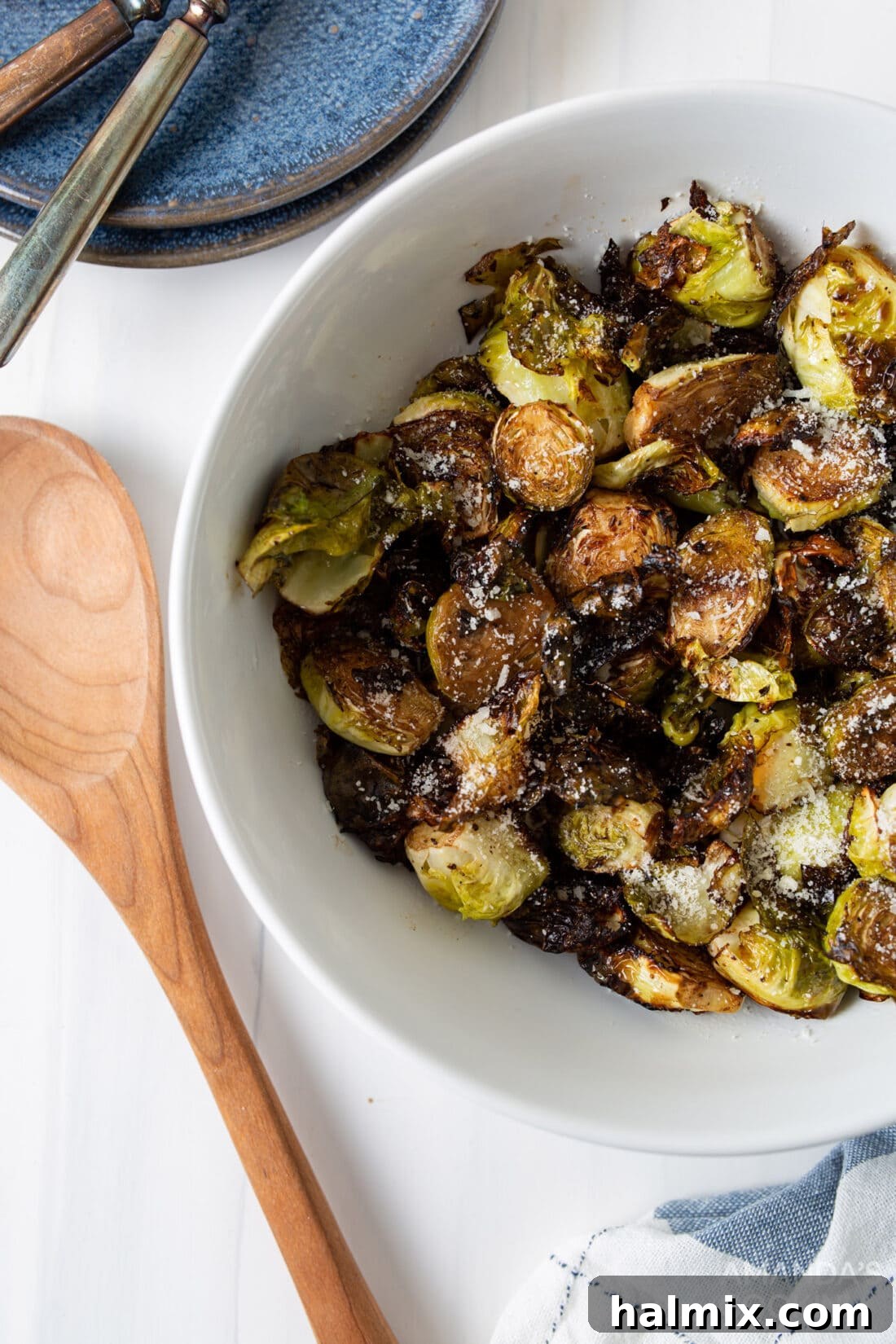 A serving bowl filled with perfectly roasted Air Fryer Brussels Sprouts, ready to be enjoyed.