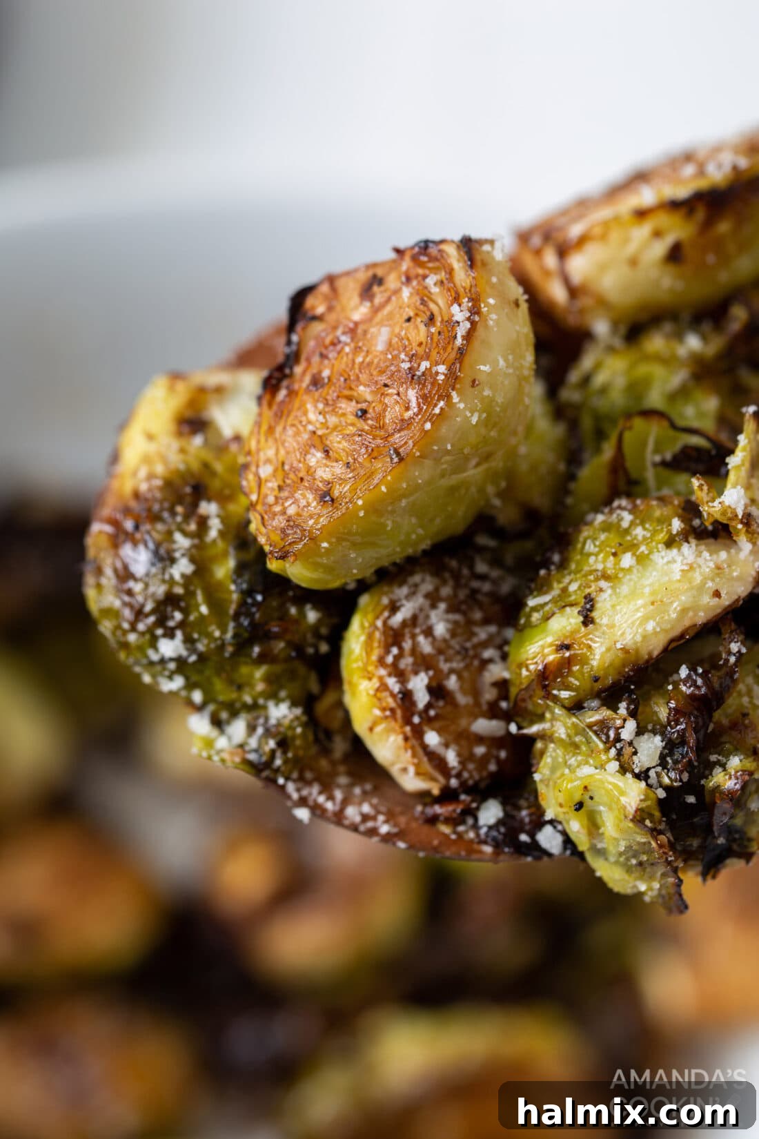 Close-up shot of crispy air-fried Brussels sprouts, highlighting their golden-brown edges and delicious texture.