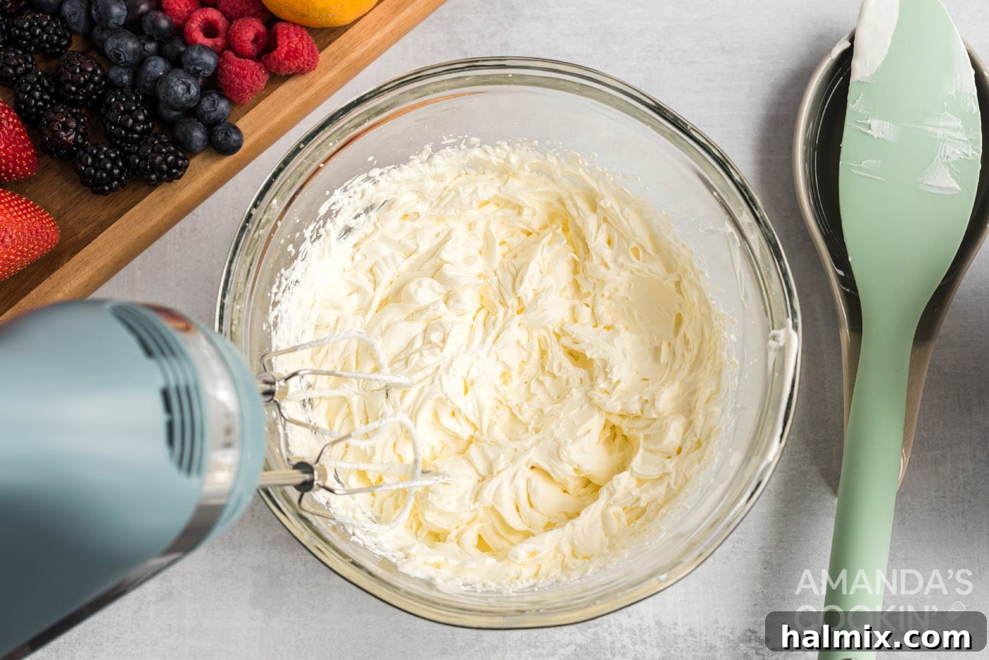 Crimson Crust Pizza 6 hand mixer beating cream cheese mixture to a fluffy consistency