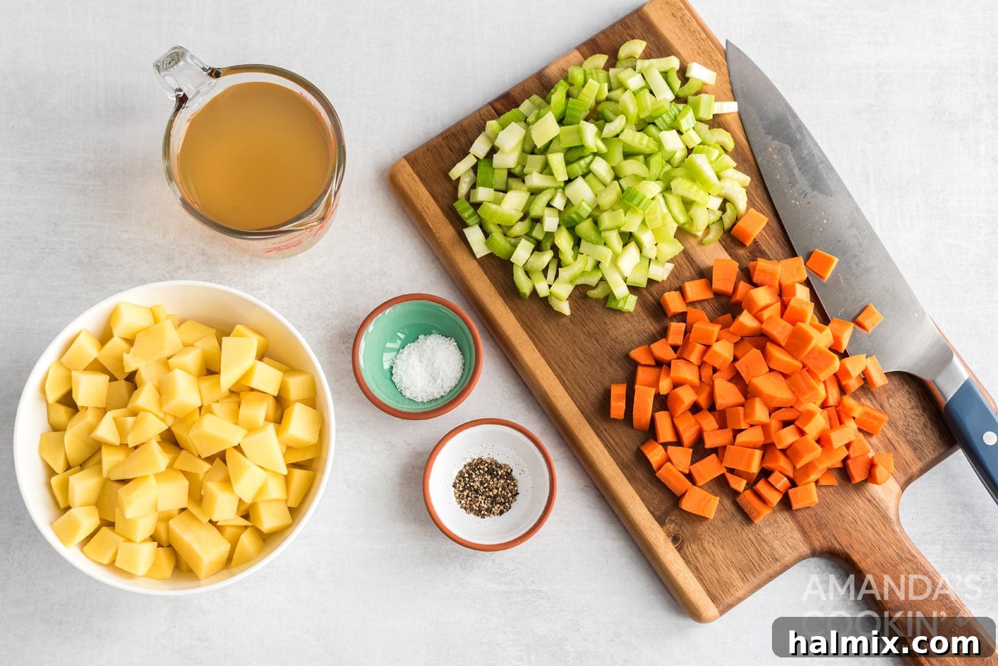Sweet Corn Comfort 5 Chopped carrots, celery, and potatoes ready to be cooked, with salt, pepper, and broth nearby