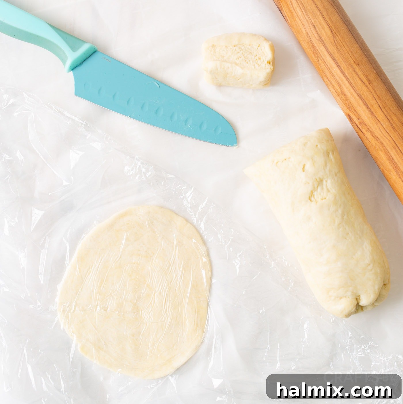 Jiffy pie dough mix rolled and cut into individual discs on a floured surface.