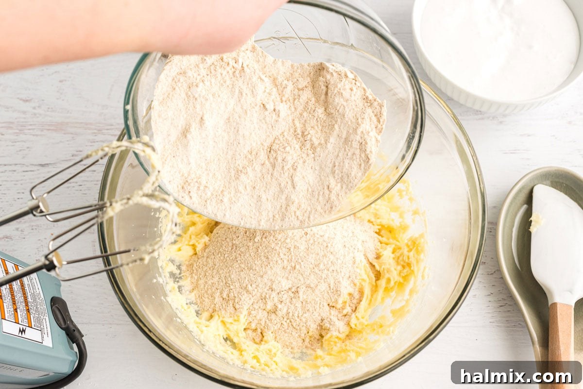 Gooey S'mores Bars 8 adding grahama cracker mixture to butter mixture