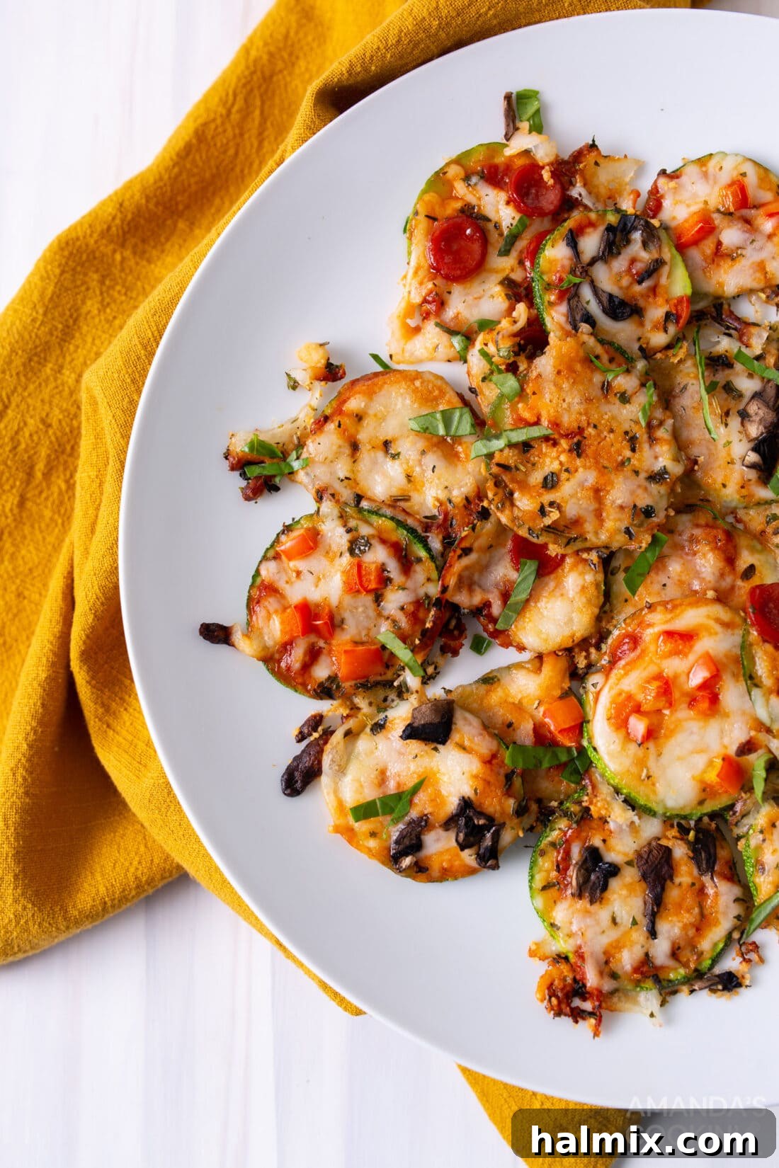 A plate brimming with freshly baked Zucchini Pizza Bites