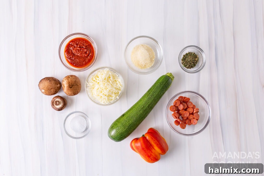 Key ingredients laid out for making Zucchini Pizza Bites