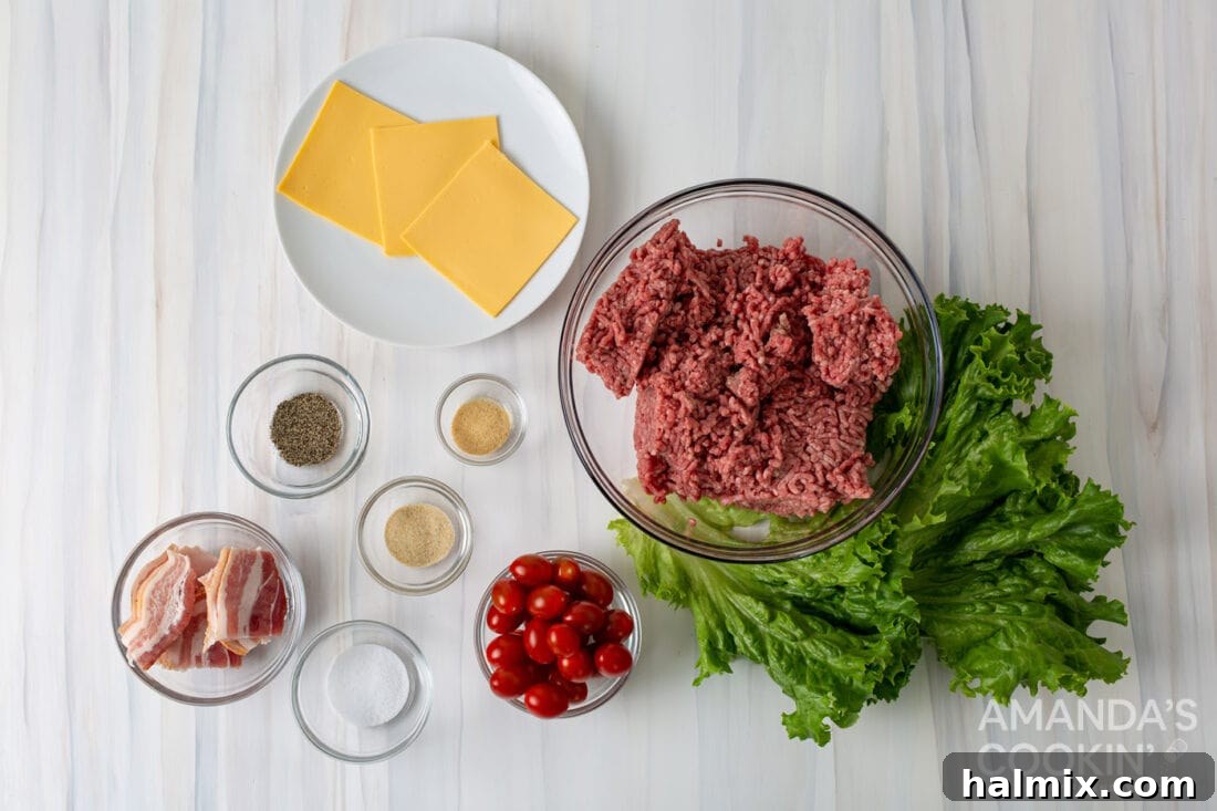 Bacon Cheeseburger Bombs 4 A selection of fresh ingredients laid out, ready for making Bacon Cheeseburger Meatballs, including ground beef, bacon, cheese, tomatoes, and lettuce.