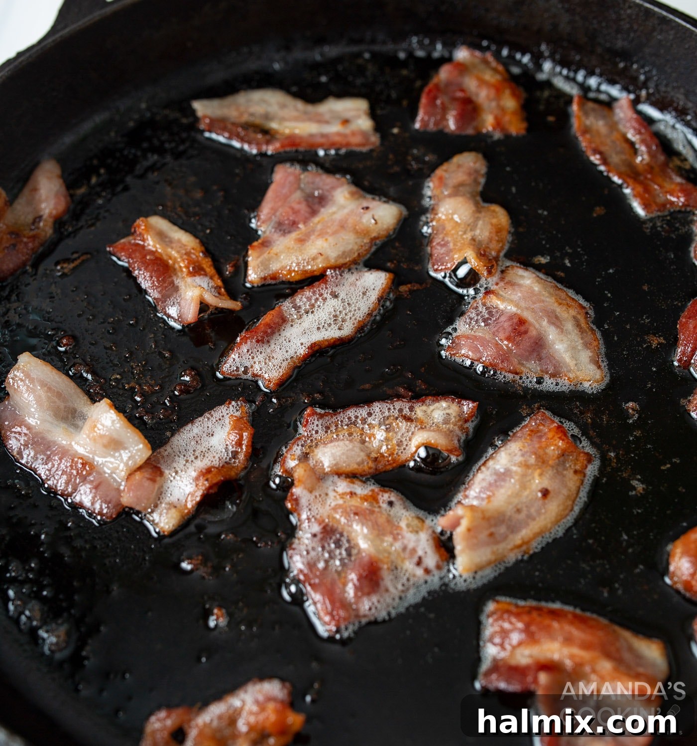 Bacon Cheeseburger Bombs 7 Crispy bacon strips sizzling in a hot skillet, bringing out their rich, smoky flavor.