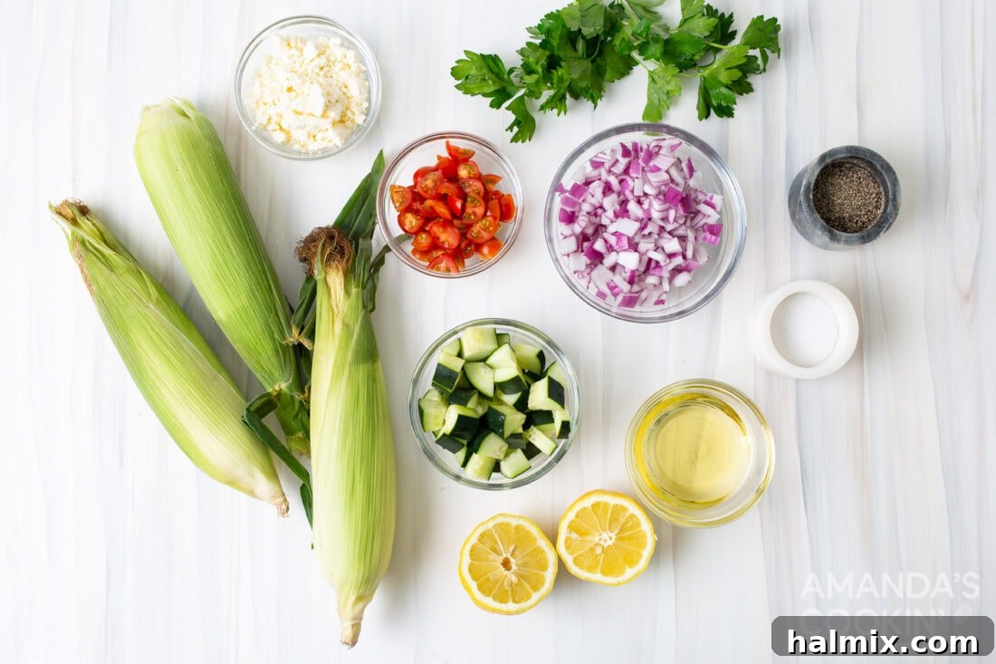 Sunshine Corn Salad 4 A collection of fresh ingredients laid out, including ears of corn, cherry tomatoes, red onion, cucumber, fresh parsley, and a block of feta cheese, ready for corn salad preparation.