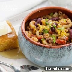 Savory One-Pot Chili Mac 2 chili mac in a bowl with cornbread on the side