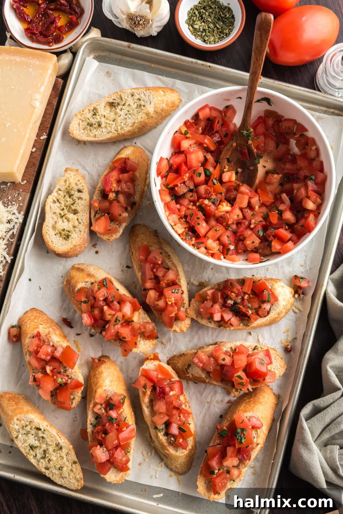 Pan of Bruschetta with a bowl of Bruschetta to the side