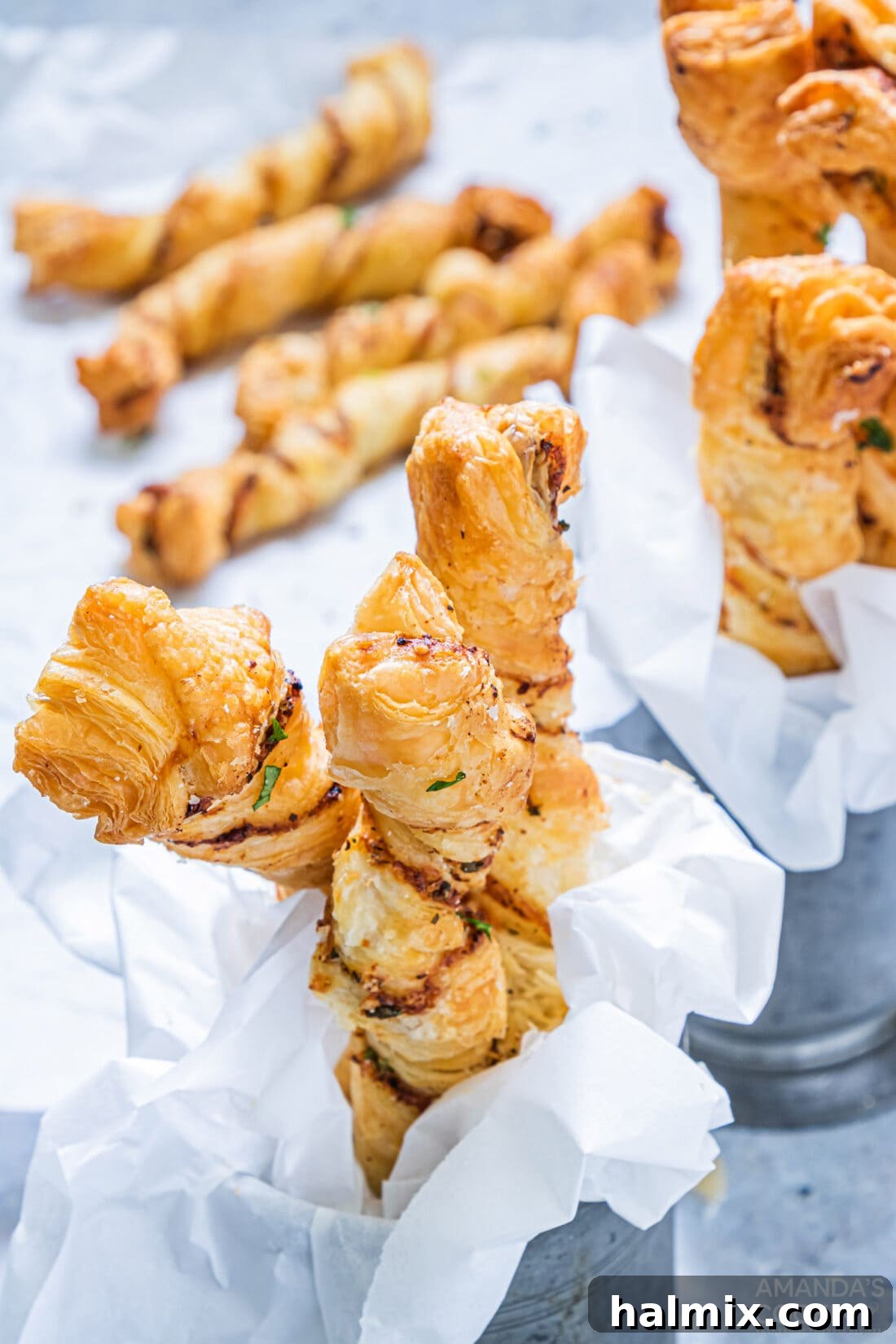 Air Fryer Garlic Parmesan Twists presented in two separate baskets