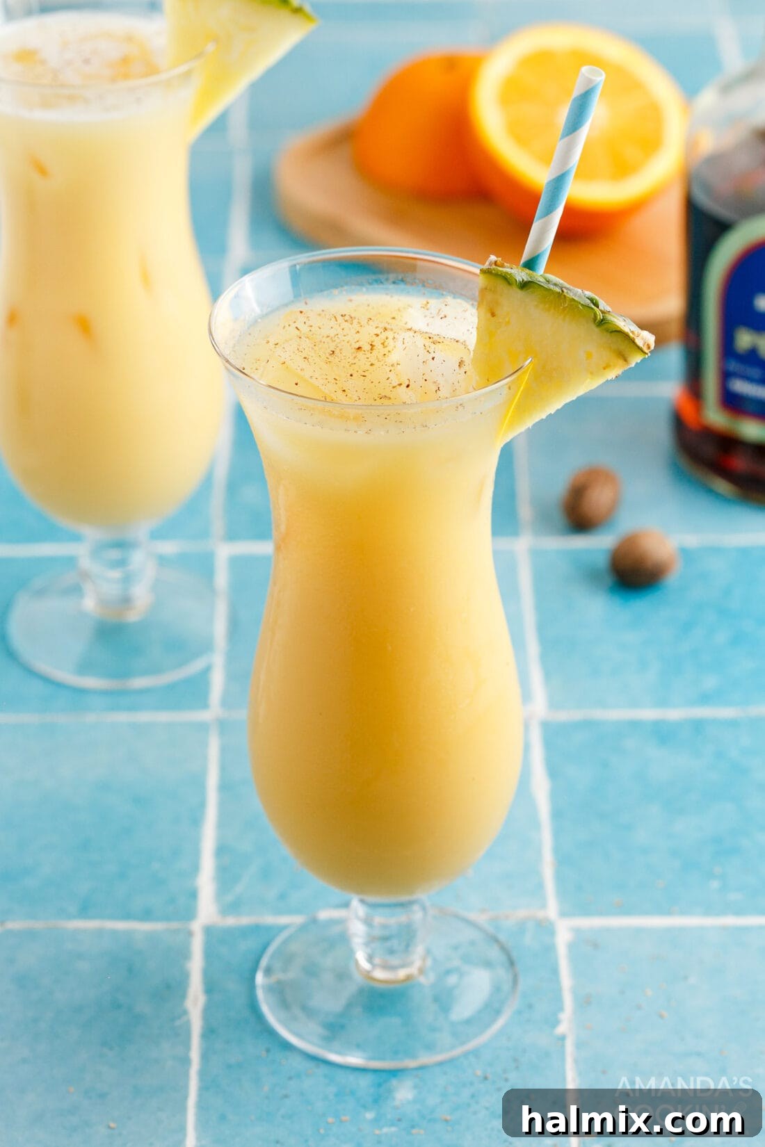 Refreshing Painkiller Cocktail served in a hurricane glass, ready for a tropical getaway