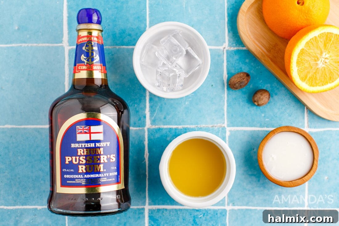 Ingredients for a Painkiller Cocktail, including a bottle of Pusser's Rum, pineapple juice, orange juice, and cream of coconut