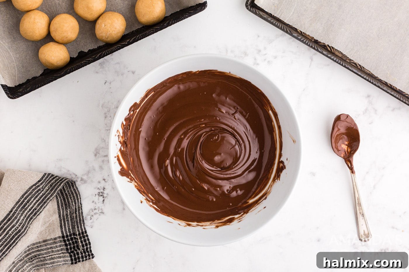 Smooth, melted semi-sweet chocolate in a microwave-safe bowl, ready for dipping.