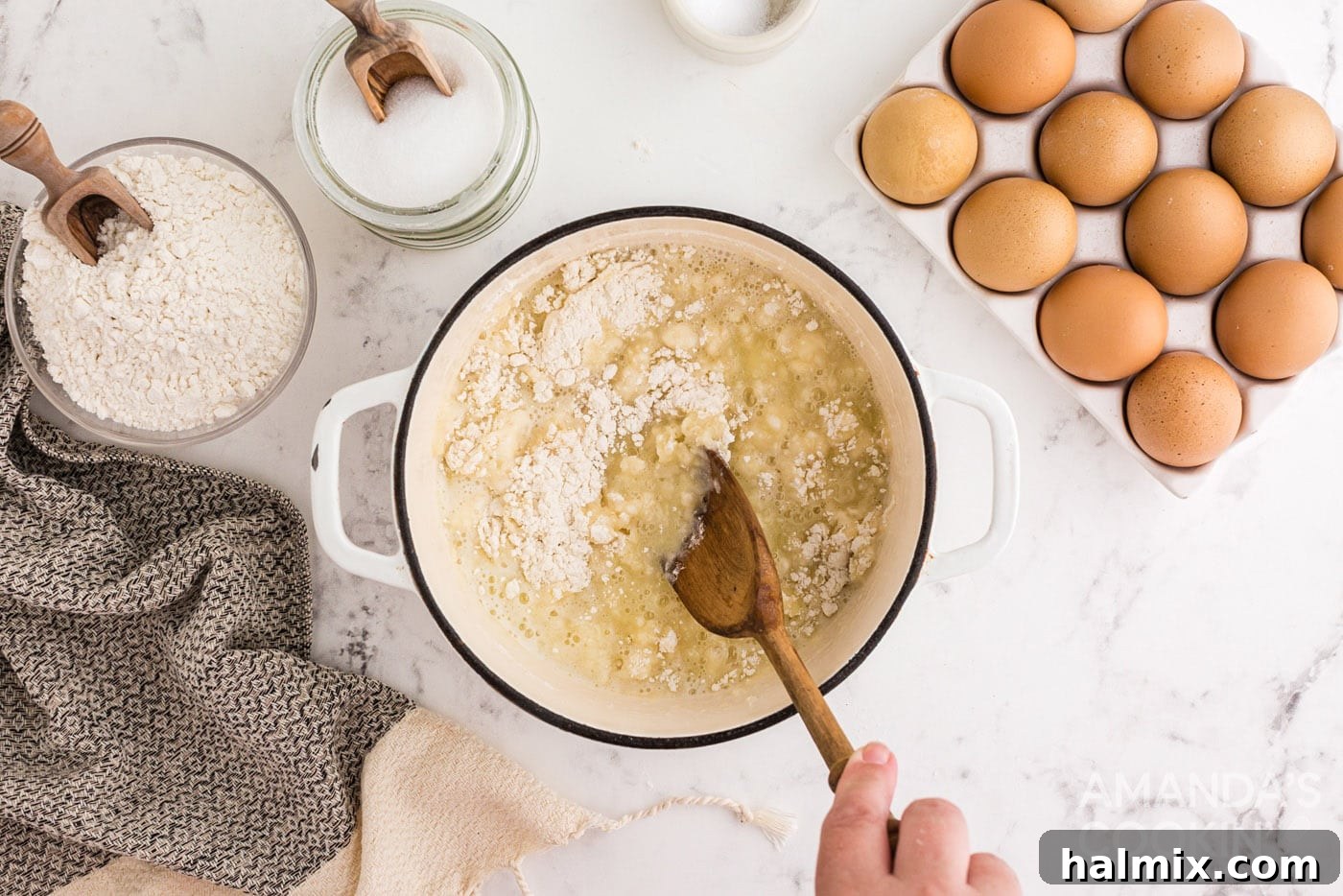 Puffy Cream Delights 6 stirring flour into butter mixture in saucepan