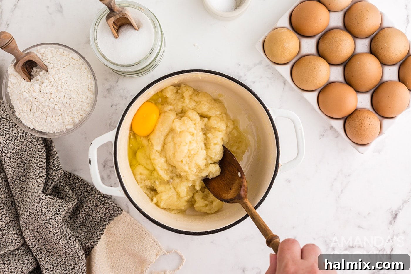 Puffy Cream Delights 7 stirring egg into dough mixture
