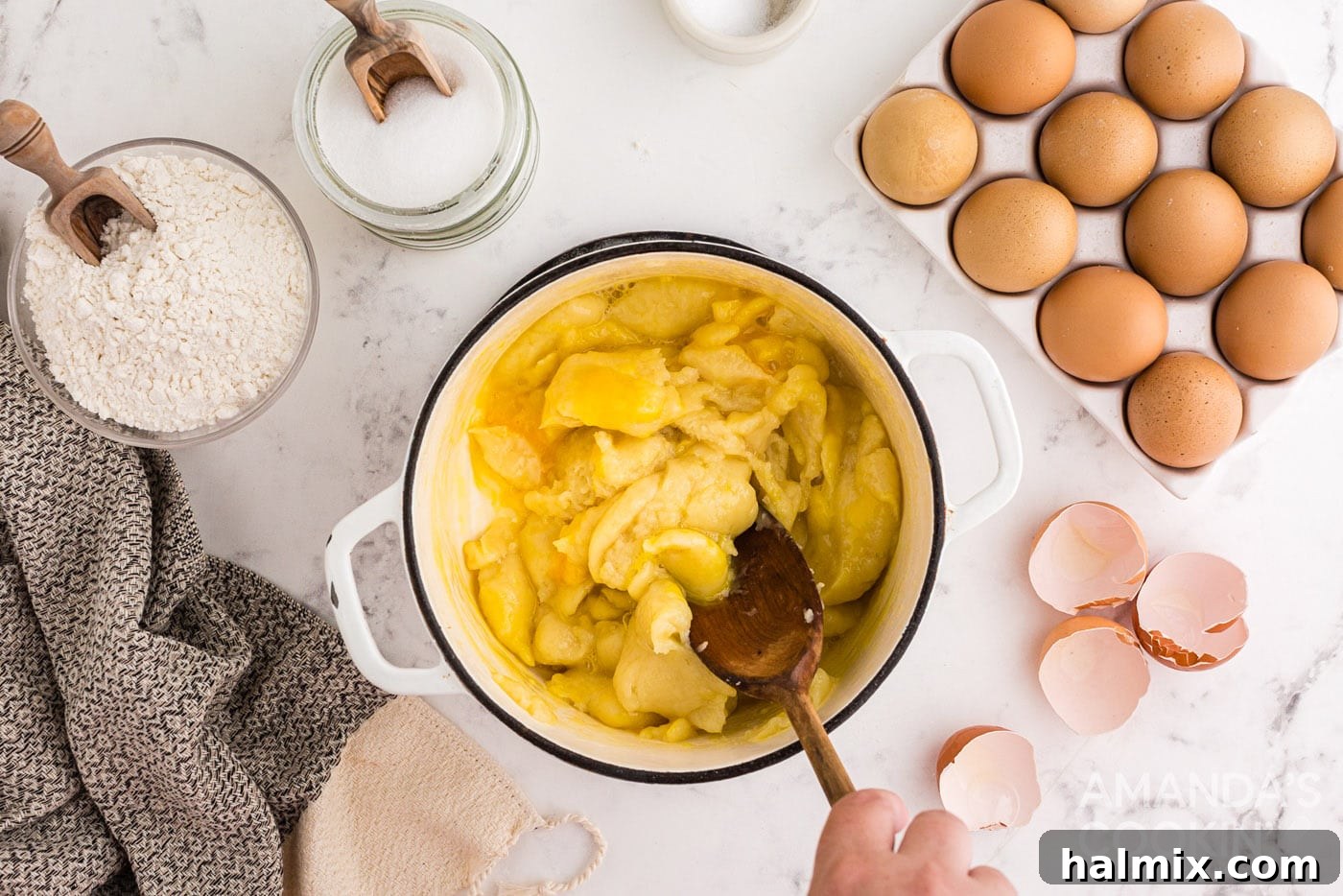 Puffy Cream Delights 8 dough in a saucepan with wooden spoon