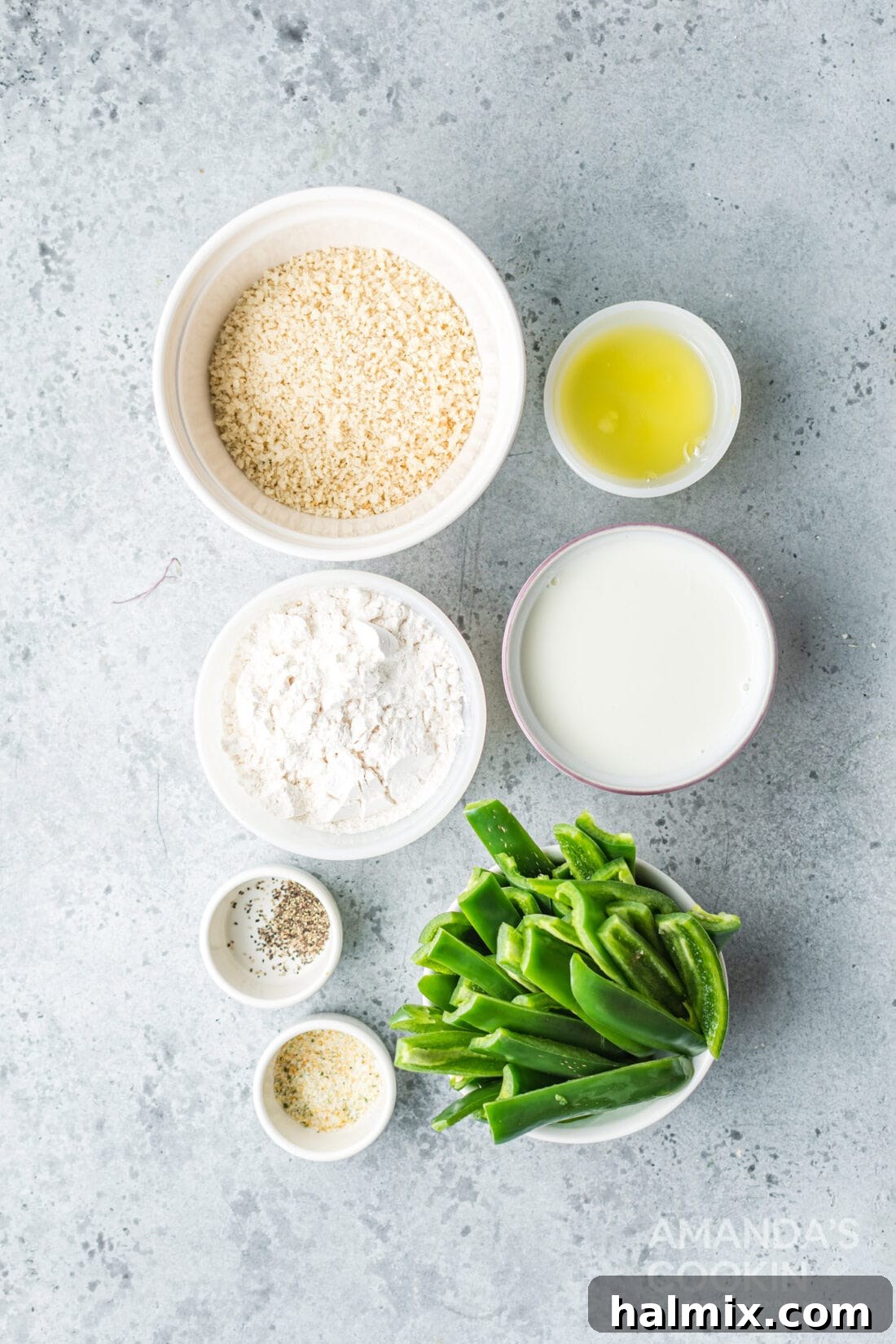 Collection of fresh ingredients for Air Fryer Jalapeno Fries, including jalapenos, buttermilk, panko, flour, eggs, and seasonings