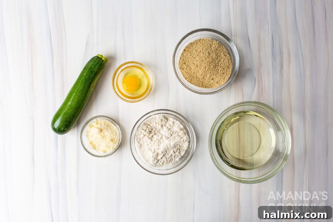 Collection of ingredients laid out for making fried zucchini