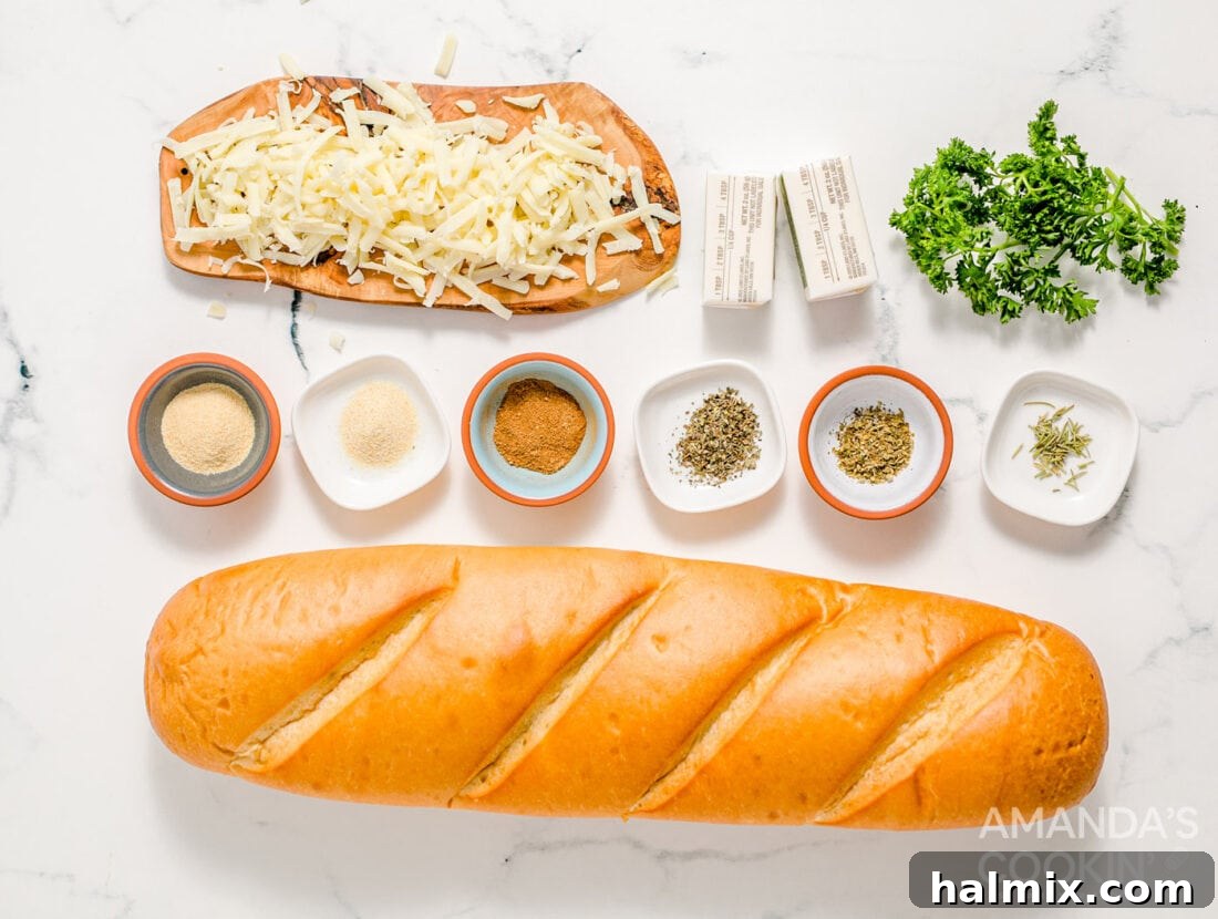 Various ingredients for Cheesy Garlic Bread laid out: a loaf of French bread, softened butter, garlic powder, dried herbs like oregano, basil, rosemary, onion powder, ground cardamom, and shredded mozzarella cheese