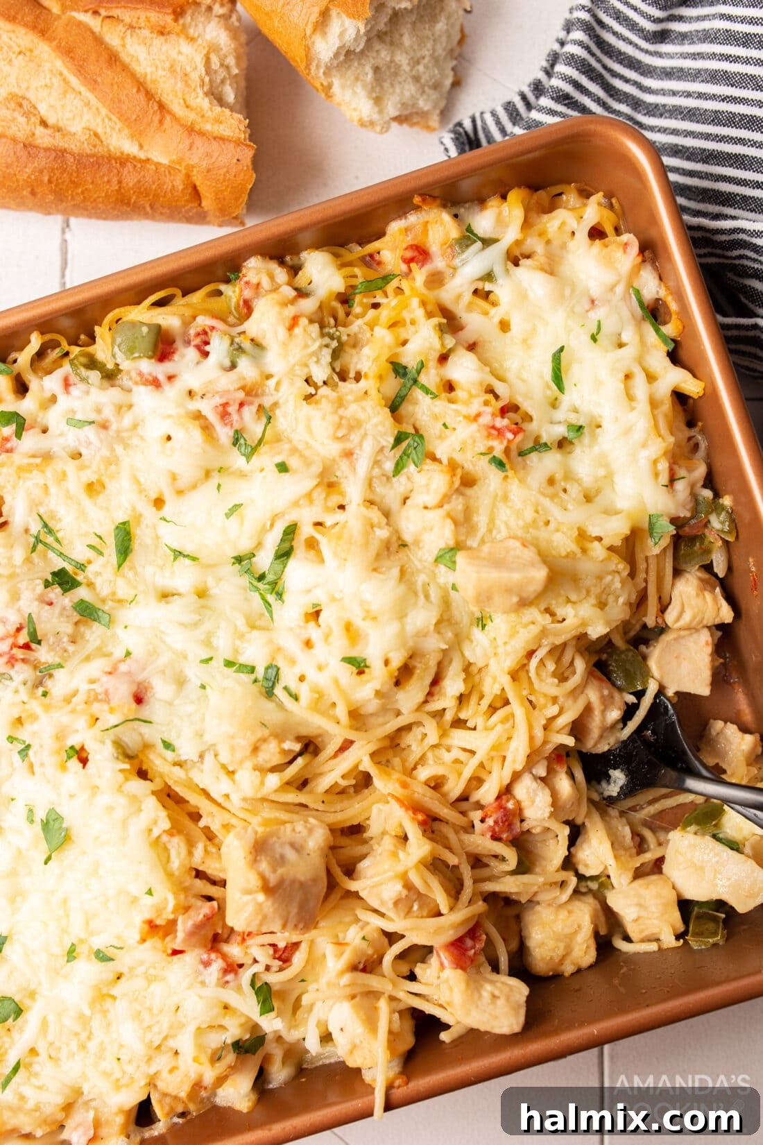 pan of chicken spaghetti, golden and bubbly, fresh from the oven
