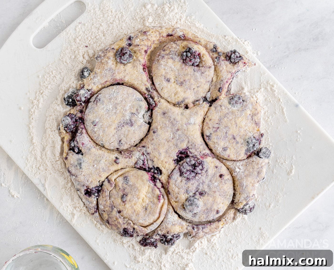 Divine Blackberry Scones 10 cutting out blackberry scone dough with a biscuit cutter