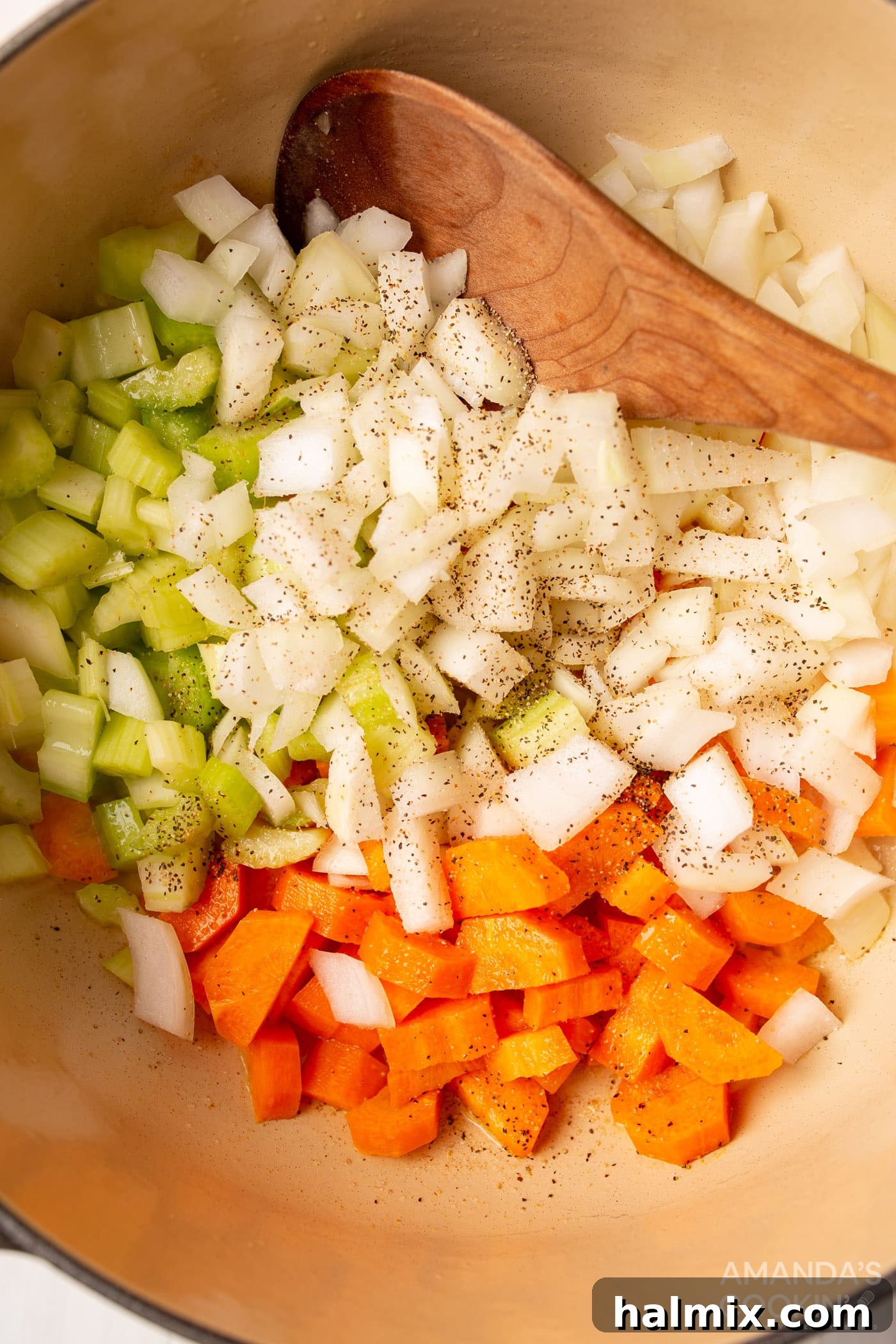 Golden Noodle Chicken Comfort 5 Diced carrots, onion, and celery sweating in melted butter in a Dutch oven.