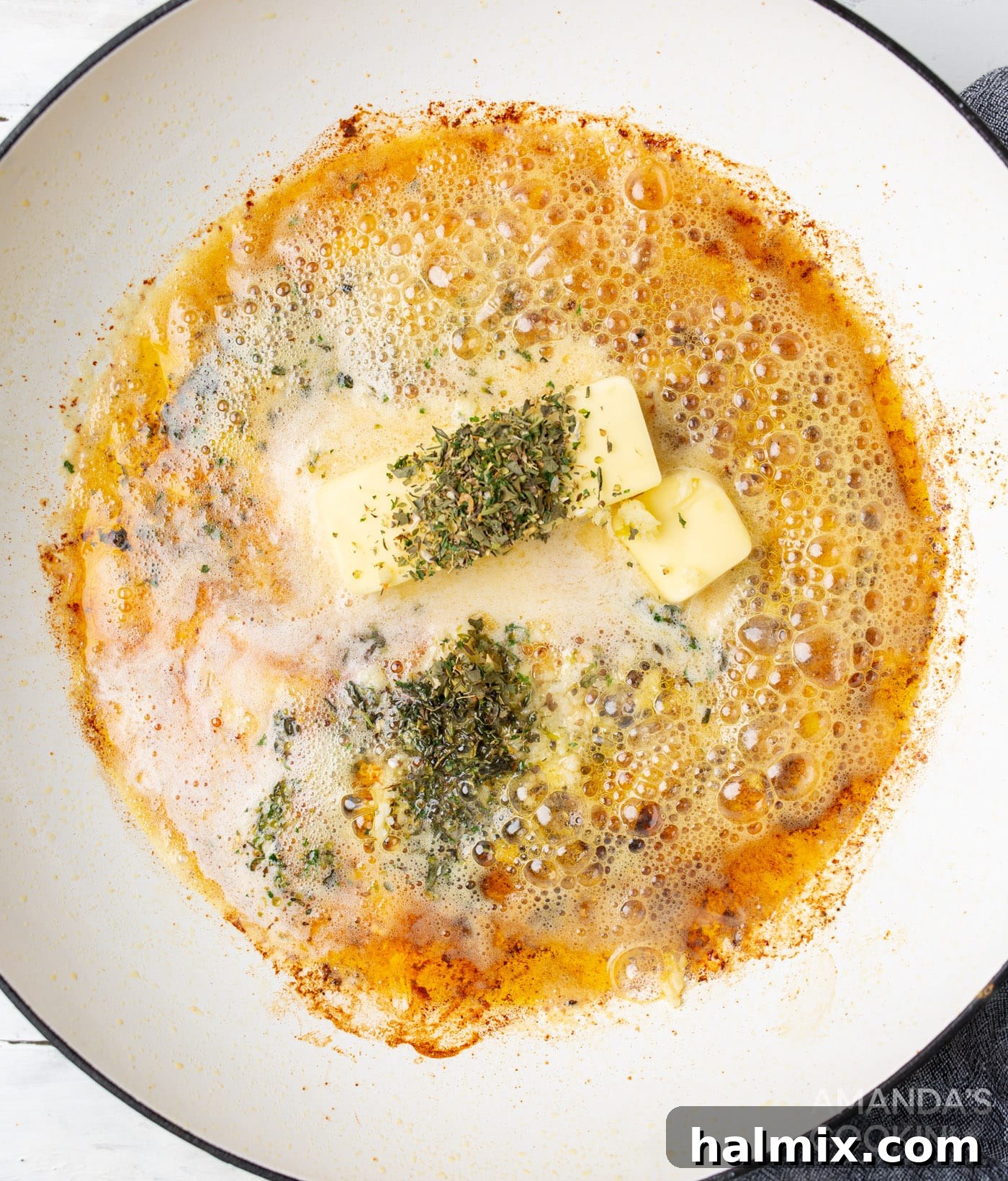 butter and seasoning for alfredo in a skillet