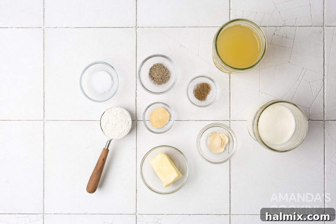 Velvety Creamy Chicken Soup 4 Ingredients laid out on a counter for making homemade cream of chicken soup: butter, flour, chicken stock, heavy cream, and various spices.